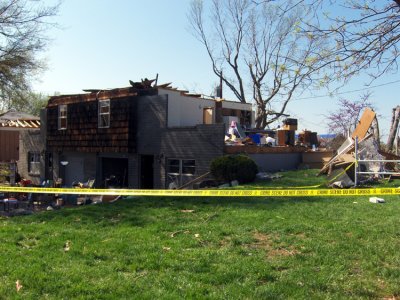 This duplex was completely demolished. I spoke with some police officers I know & they told me no one was hurt in this entire catastrophe. They'd made it downstairs to safety before it hit. Unbelievable. The crime scene tape is clearly visible.