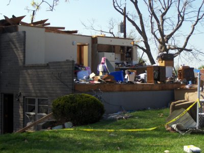 Imagine having all your personal kitchen items on display for anyone standing on the street. The devastation is amazing ... and complete. You walk through here & few words are spoken.