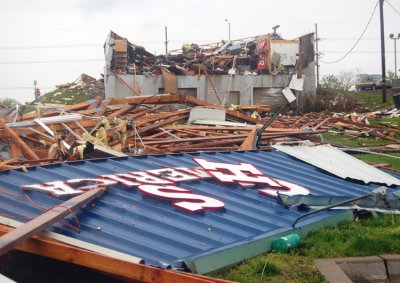 This sign was on the front of the building, and thrown by an EF02 tornado, clear across the street.
