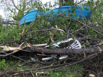 There used to be a tree under here. This is stuff that had been blown up against the tree. Swimming pools, lawn chairs, & such.