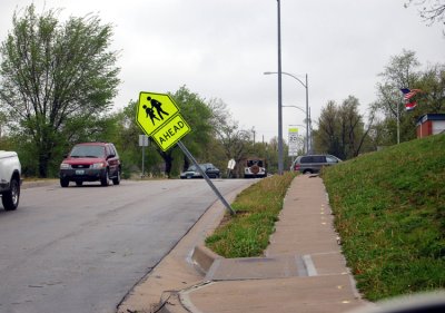 This school sign was nearly blown over into traffic.
