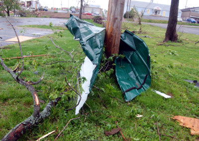 This was a piece to someone's roof. It was sent flying into & wrapped around, a telephone pole.