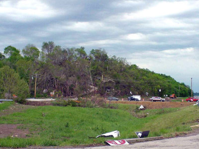 You can see the path the tornado took. It crept right up the hill taking out every single thing in its path. However, it completely missed the house sitting atop said hill.