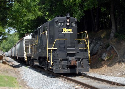 A GP9 leads a string of grain cars into Staunton Va. on the SVRR