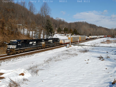 Southbound 211 is passing under the signal bridge at Red Hill.jpg