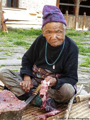 Old man producing dried meat