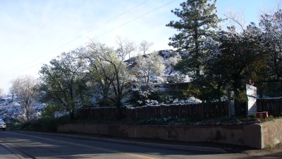 A snowy hillside along Paseo de Peralta