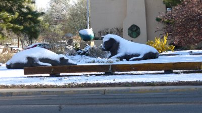 Large bison statues covered in snow