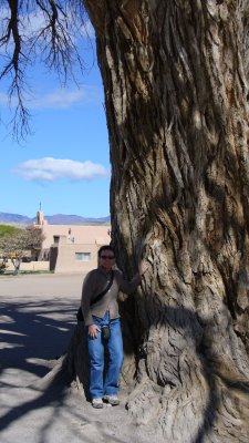 The guy in the visitor's center said people like to touch the big tree, so Kathleen did.