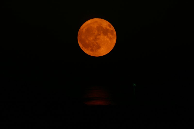 Dark moon over ocean