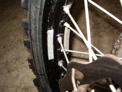 Balance weights on rim for dual sport riding