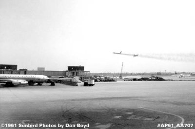 1961 - American B707 with two takeoffs in the distance