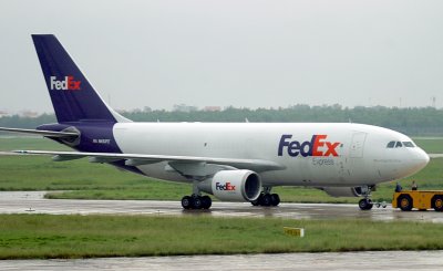 Fedex A-310 being towed at SGN