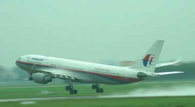 Malaysian A-330 taking off in the pouring rain, SGN, Aug 2008
