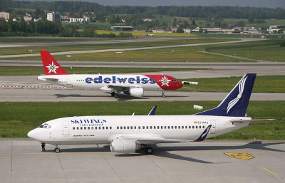 Skyking 737-300 with Edelweiss A-320 in the background