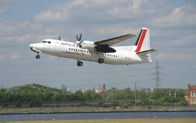 Fokker-50 in City Jet colour taking off from LCY RWY 9