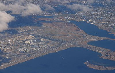 Aerial view of JFK, note on the left a plane is approaching RWY 31L