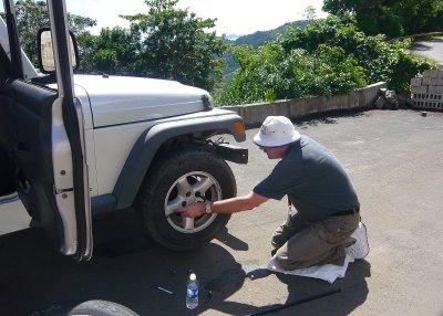 Not our best day: We had a leaking tire, and Howard had to change it - right there on Ridge Rd. on the mountain!