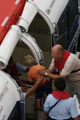 Our youngest cruiser getting a lift onto the tender boat.  (We tendered in Virgin Gorda, St. Barts, and Samana)