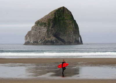 Beautiful Oregon coast: Surfer at Kiwanda