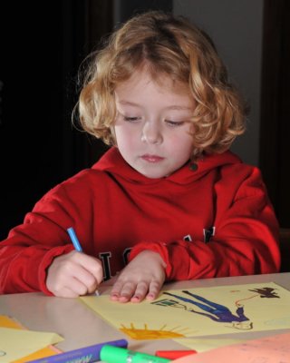 Signing her artwork