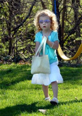 Ellie loads up her bag during the egg hunt