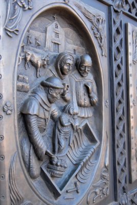 Scene in the doors showing the travels of the Mary Statue