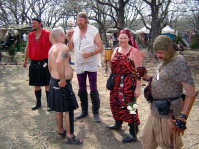 Hunter, Link Wilma and others discussing whether William is wearing a skirt or a kilt