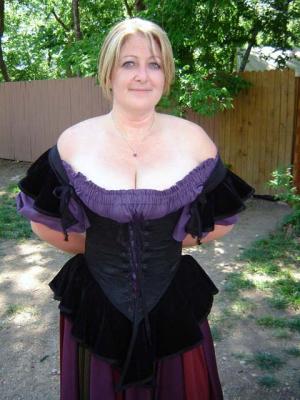 First time in Garb!   Looking Good, and she proves she can catch the Kings Nuts in her cleavage too!