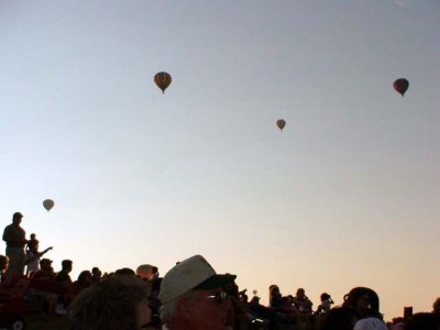 The balloons flying as the sun goes down