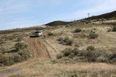 Tom's van descends a hill.