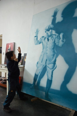 A little boy & a large painting