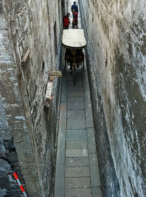 Pedicab in a narrow alley