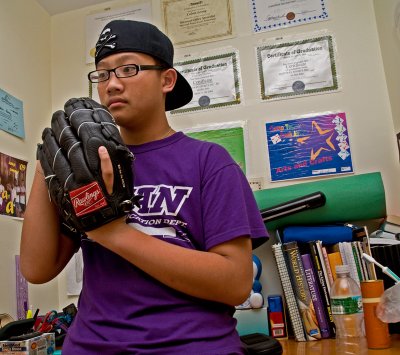 Calvin with catcher's mitt, books,awards