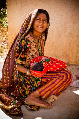 Ahir woman with baby by clinic