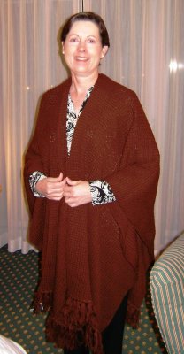 Each female who had earned this trip was given a super-soft & warm shawl.  Men who had earned this trip (or their wives had earned enough for them to accompany them) were given similar red-crocheted neck scarves.  This was my roommate for the trip, (another consultant under Kathi's group), modeling her shawl.