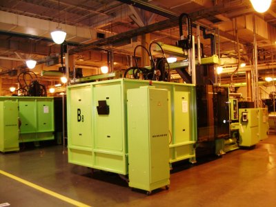 These big bright green machines in the background are what these molds fit into to produce the various products.