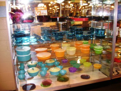 Several display shelves outside the Quality Assurance room, showing many of the products made here.