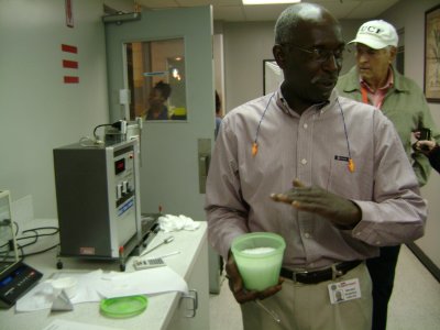 Inside the QA room and being explained how their first test is done on the plastic raw material pellets they receive by the trainload outside and put into their huge silo's. Each silo can hold 200,000 pounds of these plastic pieces. The test is conducted first to see if each batch of pellets is equal to the high quality that TW requires.