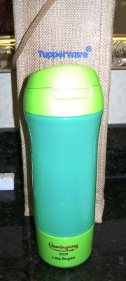 A brand new piece of TW not yet released but will be in the Spring/Summer catalog. This is a new sports bottle with snap-off green bottom to keep dry snacks in. Check out what's written on it!