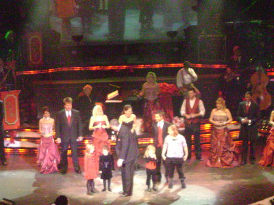 Right after one of the solo's, they asked for all children in the audience to come up on stage and help them sing the next song.  One of the little girls (in the black dress) was the daughter of the soloist standing in back of her (also wearing a black dress).