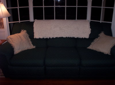 Made for a very good friend's 50th birthday.  (Shown on our couch.)  This yarn is so incredibly SOFT and lightweight that it made the perfect light-weight, cuddly couch afghan.  Very simply done in the same stitch throughout (her choice)