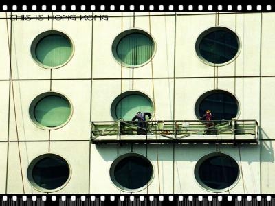 Window cleaners at Jardine House