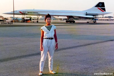 A young European lady with a British Airways Concorde in the background at Miami International Airport