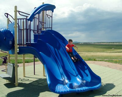 July 2009 - Kyler on the big slide at playground at Peterson AFB, Colorado