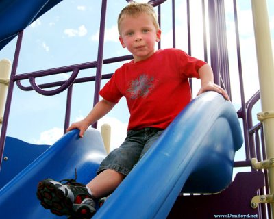 July 2009 - Kyler at the top of the big slide at the playground at Peterson AFB, Colorado