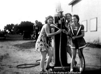 1940's - Ann Zink (pointing the hose) and two girlfriends at a gas station on North Miami Avenue