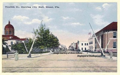 1910 - Twelfth Street (later Flagler) at the railroad tracks with the county courthouse (left) and Miami City Hall (right)