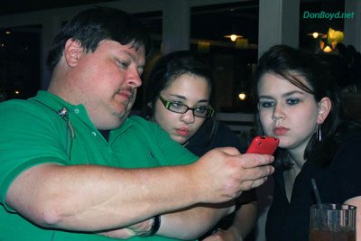 Jimmy Farmer showing our servers Shay Casper and Ashley McClellan photos of Old Joels huge Viagra supply