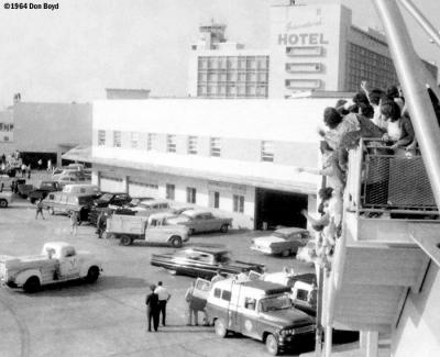 1964 - the Beatles departing Miami International Airport in the black limo, lower center